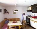 For larger scale of picture click here! Holiday apartment Mountain in the Goegerhaus: kitchen table with sideboard (JPG, 4 kByte)